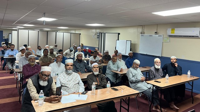 A group of attendees at the employee education meeting.